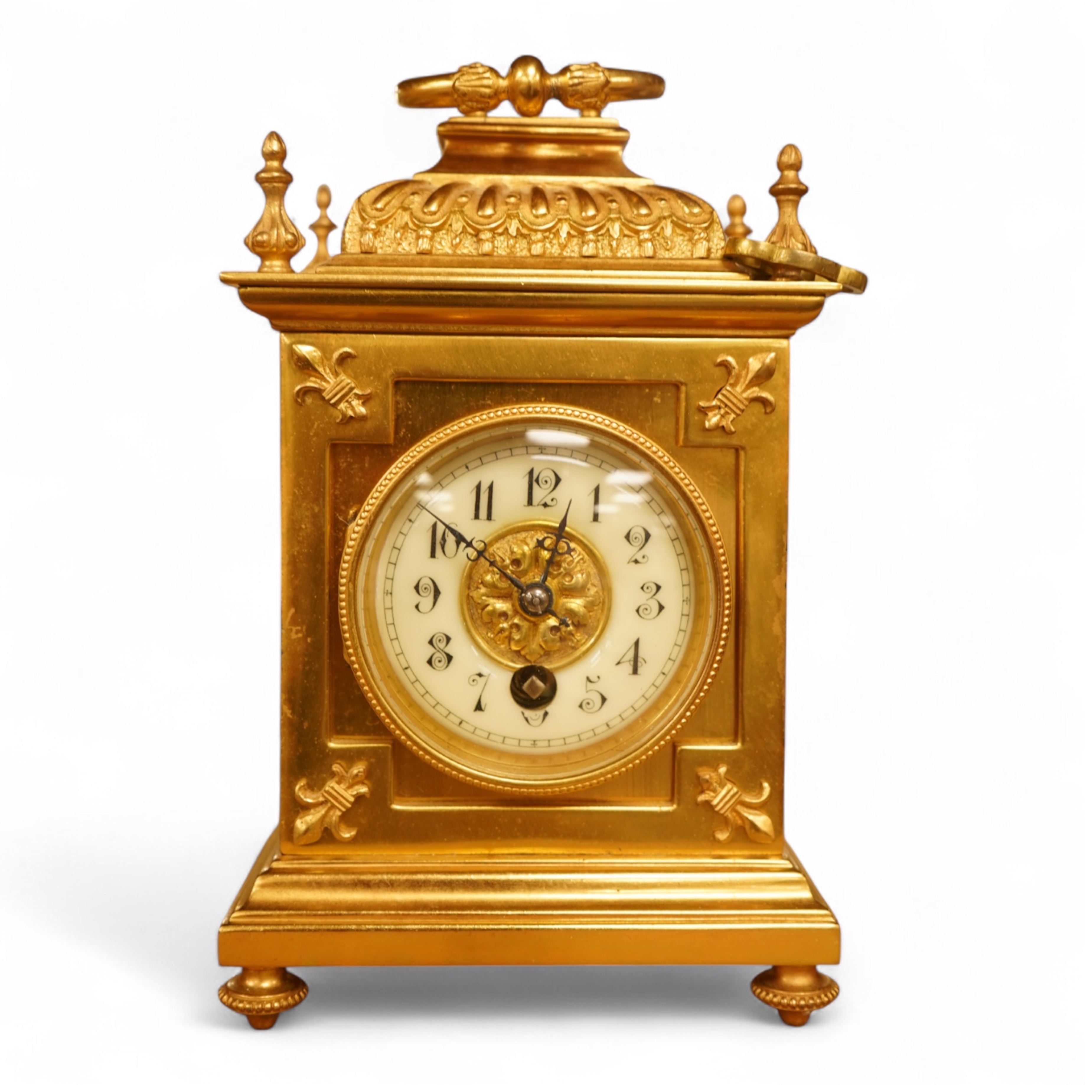 A French gilt brass timepiece with key, 19cm high